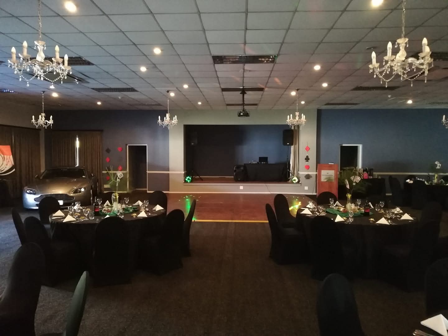 Formal function hall with tables and stage area prepared for an event